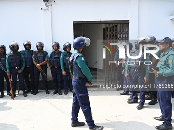 Police personnel stand guard in front of Bangladesh's International Crimes Tribunal (ICT) court in Dhaka, Bangladesh, on November 18, 2024....