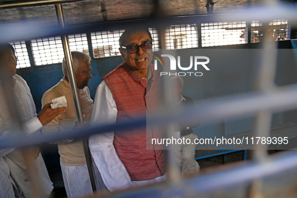 Former ministers and leaders of the Bangladesh Awami League party look on from a police vehicle outside Bangladesh's International Crimes Tr...