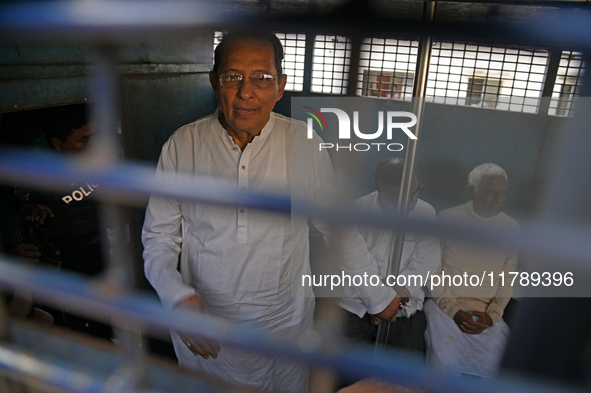 Former ministers and leaders of the Bangladesh Awami League party look on from a police vehicle outside Bangladesh's International Crimes Tr...