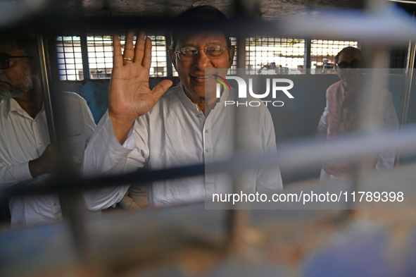 Former ministers and leaders of the Bangladesh Awami League party look on from a police vehicle outside Bangladesh's International Crimes Tr...