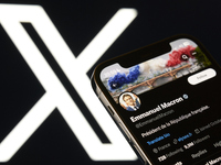 An editorial image shows an iPhone screen displaying Emmanuel Macron's personal account on the X social network platform. The X logo appears...