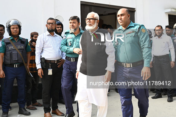 Police personnel escort detainee Salman F. Rahman, adviser to former Prime Minister Sheikh Hasina, former Minister, and a member of Banglade...