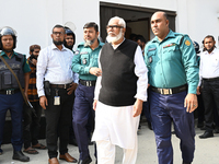 Police personnel escort detainee Salman F. Rahman, adviser to former Prime Minister Sheikh Hasina, former Minister, and a member of Banglade...