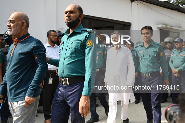 Police personnel escort detainee former ministers and leaders of the Bangladesh Awami League party to the country's International Crimes Tri...