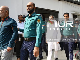 Police personnel escort detainee former ministers and leaders of the Bangladesh Awami League party to the country's International Crimes Tri...