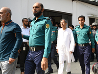 Police personnel escort detainee former ministers and leaders of the Bangladesh Awami League party to the country's International Crimes Tri...