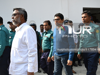 Police personnel escort detainee former ministers and leaders of the Bangladesh Awami League party to the country's International Crimes Tri...