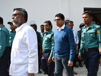 Police personnel escort detainee former ministers and leaders of the Bangladesh Awami League party to the country's International Crimes Tri...