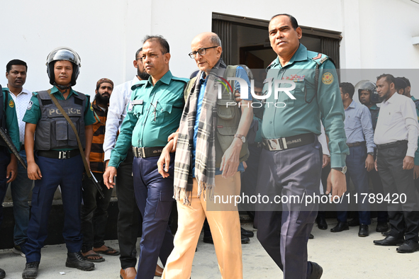 Police personnel escort detainee Dr. Taufiq-e-Ilahi Chowdhury, adviser to former Prime Minister Sheikh Hasina, former Minister, and a member...