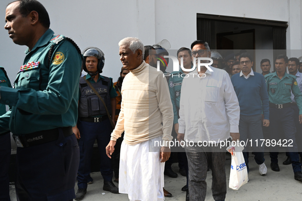 Police personnel escort detainee former ministers and leaders of the Bangladesh Awami League party to the country's International Crimes Tri...