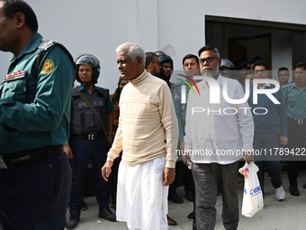 Police personnel escort detainee former ministers and leaders of the Bangladesh Awami League party to the country's International Crimes Tri...