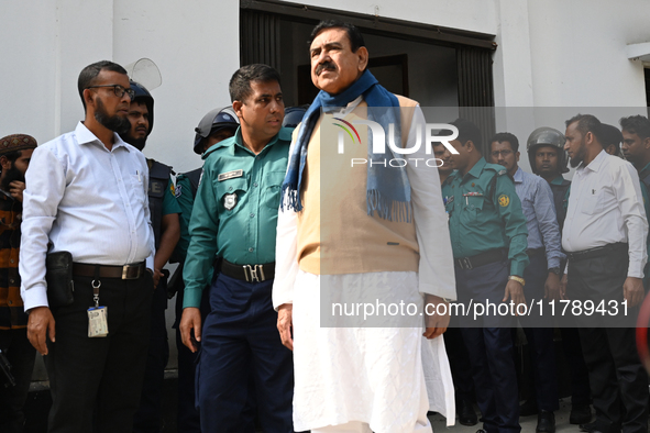 Police personnel escort detainee Shajahan Khan, former Minister and a member of Bangladesh's ousted former Prime Minister Sheikh Hasina's Aw...