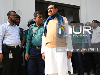 Police personnel escort detainee Shajahan Khan, former Minister and a member of Bangladesh's ousted former Prime Minister Sheikh Hasina's Aw...