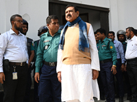 Police personnel escort detainee Shajahan Khan, former Minister and a member of Bangladesh's ousted former Prime Minister Sheikh Hasina's Aw...