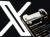 An editorial image shows an iPhone screen displaying Barack Obama's personal account on the X social network platform. The X logo appears su...