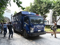 Prison vans transport former ministers and leaders of the Bangladesh Awami League party to jail after their court hearing from the Banglades...