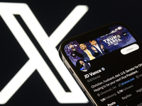 An editorial image shows an iPhone screen displaying JD Vance's personal account on the X social network platform. The X logo appears subtly...