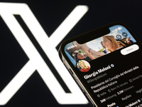 An editorial image shows an iPhone screen displaying Giorgia Meloni's personal account on the X social network platform. (