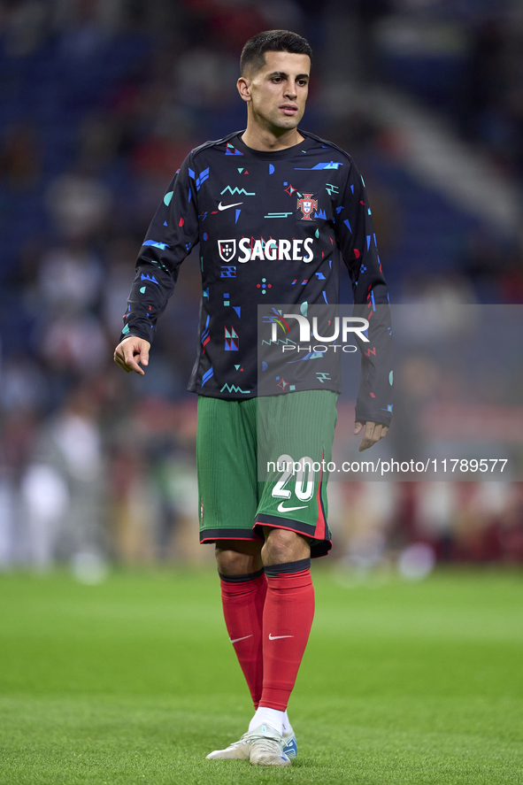 Joao Cancelo of Portugal looks on during the warm-up prior to the UEFA Nations League 2024/25 League A Group A1 match between Portugal and P...