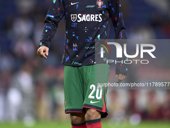 Joao Cancelo of Portugal looks on during the warm-up prior to the UEFA Nations League 2024/25 League A Group A1 match between Portugal and P...