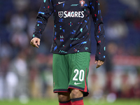 Joao Cancelo of Portugal looks on during the warm-up prior to the UEFA Nations League 2024/25 League A Group A1 match between Portugal and P...