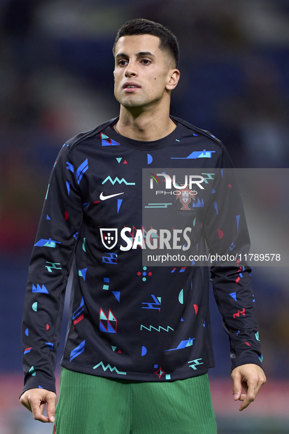 Joao Cancelo of Portugal looks on during the warm-up prior to the UEFA Nations League 2024/25 League A Group A1 match between Portugal and P...