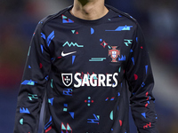 Joao Cancelo of Portugal looks on during the warm-up prior to the UEFA Nations League 2024/25 League A Group A1 match between Portugal and P...