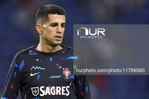 Joao Cancelo of Portugal looks on during the warm-up prior to the UEFA Nations League 2024/25 League A Group A1 match between Portugal and P...