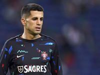 Joao Cancelo of Portugal looks on during the warm-up prior to the UEFA Nations League 2024/25 League A Group A1 match between Portugal and P...