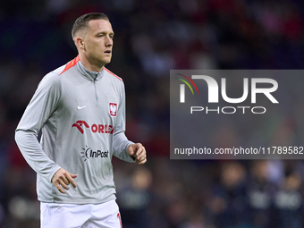 Piotr Zielinski of Poland looks on during the warm-up prior to the UEFA Nations League 2024/25 League A Group A1 match between Portugal and...