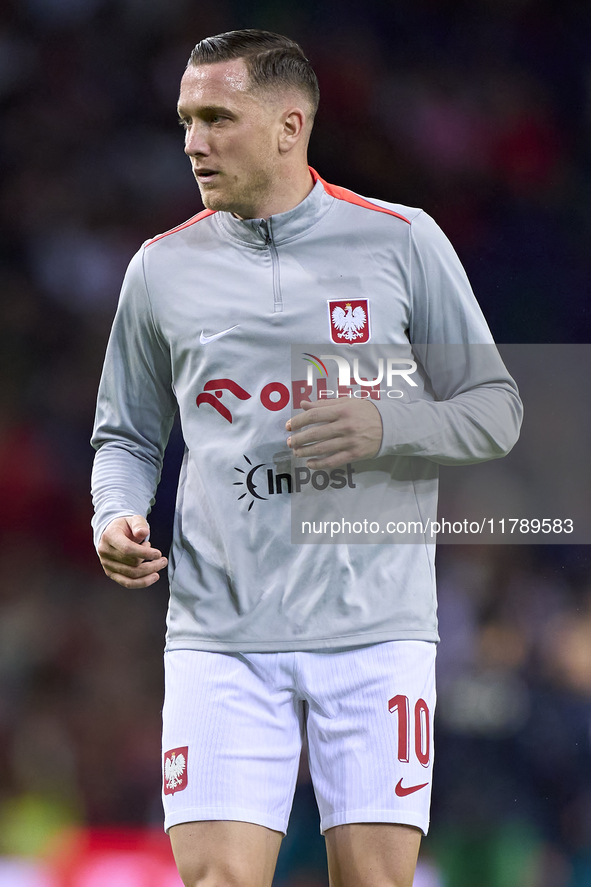 Piotr Zielinski of Poland looks on during the warm-up prior to the UEFA Nations League 2024/25 League A Group A1 match between Portugal and...