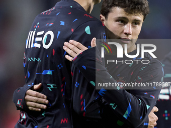 Joao Neves hugs Antonio Silva of Portugal during the warm-up prior to the UEFA Nations League 2024/25 League A Group A1 match between Portug...