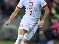 Kacper Urbanski of Poland plays during the UEFA Nations League 2024/25 League A Group A1 match between Portugal and Poland at Estadio Do Dra...