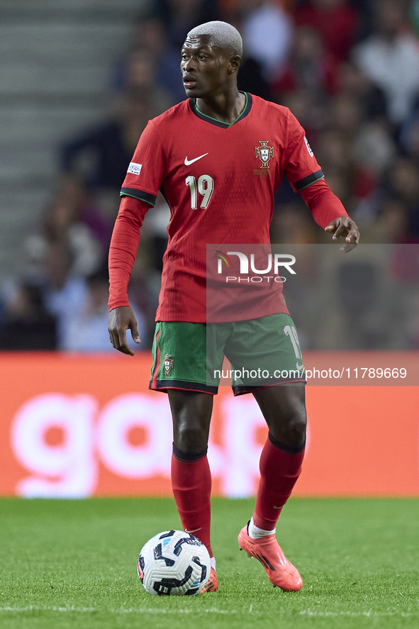 Nuno Mendes of Portugal is in action during the UEFA Nations League 2024/25 League A Group A1 match between Portugal and Poland at Estadio D...