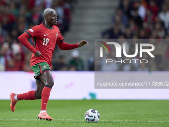 Nuno Mendes of Portugal is in action during the UEFA Nations League 2024/25 League A Group A1 match between Portugal and Poland at Estadio D...