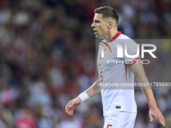 Jan Bednarek of Poland reacts during the UEFA Nations League 2024/25 League A Group A1 match between Portugal and Poland at Estadio Do Draga...