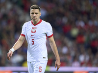 Jan Bednarek of Poland looks on during the UEFA Nations League 2024/25 League A Group A1 match between Portugal and Poland at Estadio Do Dra...