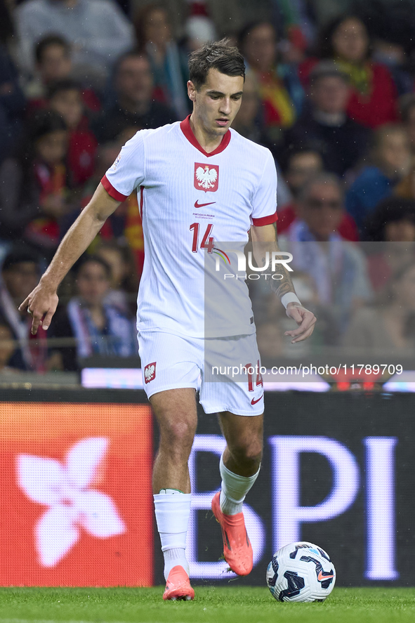 Jakub Kiwior of Poland is in action during the UEFA Nations League 2024/25 League A Group A1 match between Portugal and Poland at Estadio Do...