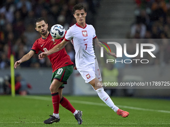 Bernardo Silva of Portugal competes for the ball with Kacper Urbanski of Poland during the UEFA Nations League 2024/25 League A Group A1 mat...