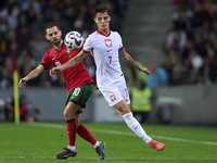 Bernardo Silva of Portugal competes for the ball with Kacper Urbanski of Poland during the UEFA Nations League 2024/25 League A Group A1 mat...