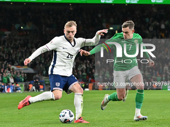 Jarrod Bowen is challenged by Sammie Szmodics (7 Republic of Ireland) during the UEFA Nations League 2024/5, League B, Group B2 match betwee...