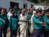 Police personnel escort detainee Dipu Moni, a former minister of Bangladesh's ousted government led by the Bangladesh Awami League, to the I...