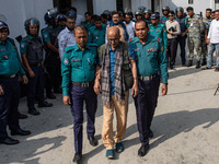 Police personnel escort detainee Tawfiq-e-Elahi Chowdhury, former energy adviser to the ousted Prime Minister of Bangladesh Sheikh Hasina, t...