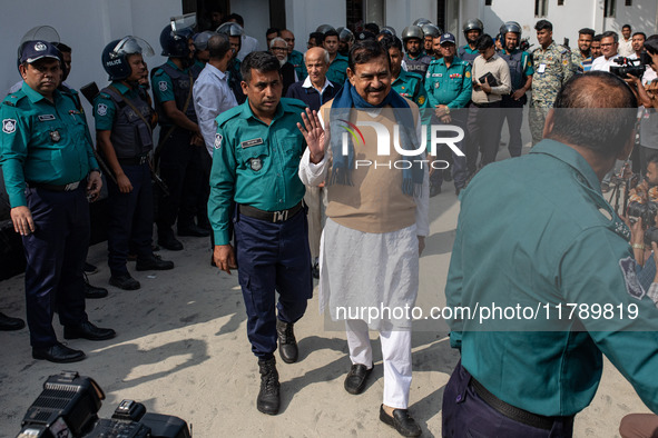 Police personnel escort detainee Shajahan Khan, a former Member of Parliament of Bangladesh's ousted government led by the Bangladesh Awami...