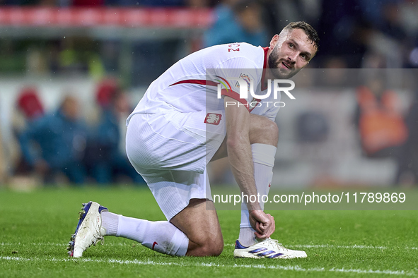 Sebastian Walukiewicz of Poland reacts during the UEFA Nations League 2024/25 League A Group A1 match between Portugal and Poland at Estadio...