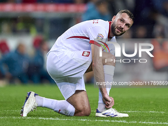 Sebastian Walukiewicz of Poland reacts during the UEFA Nations League 2024/25 League A Group A1 match between Portugal and Poland at Estadio...