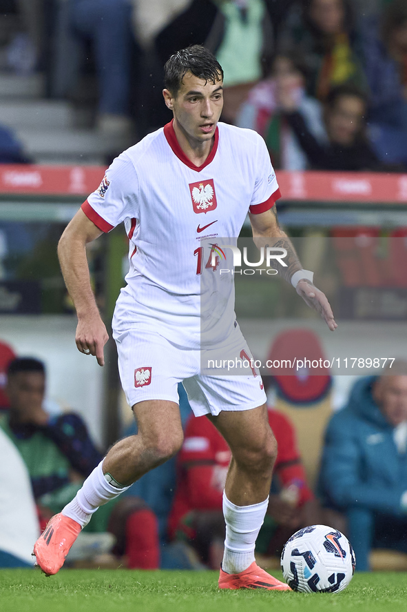 Jakub Kiwior of Poland is in action during the UEFA Nations League 2024/25 League A Group A1 match between Portugal and Poland at Estadio Do...