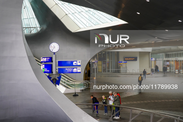 People are in the entrance hall of Arnhem Centraal station in Arnhem, The Netherlands, on July 27, 2023. The station's futuristic design, wi...