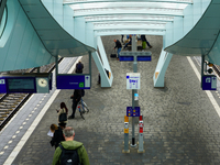 A view of Platform 7 at Arnhem Centraal Station in Arnhem, Netherlands, on July 27, 2023, shows passengers waiting under the sleek modern ca...