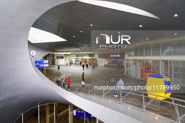 The entrance hall of Arnhem Centraal Station in the Netherlands, on July 27, 2023, features a futuristic architectural design with sweeping...